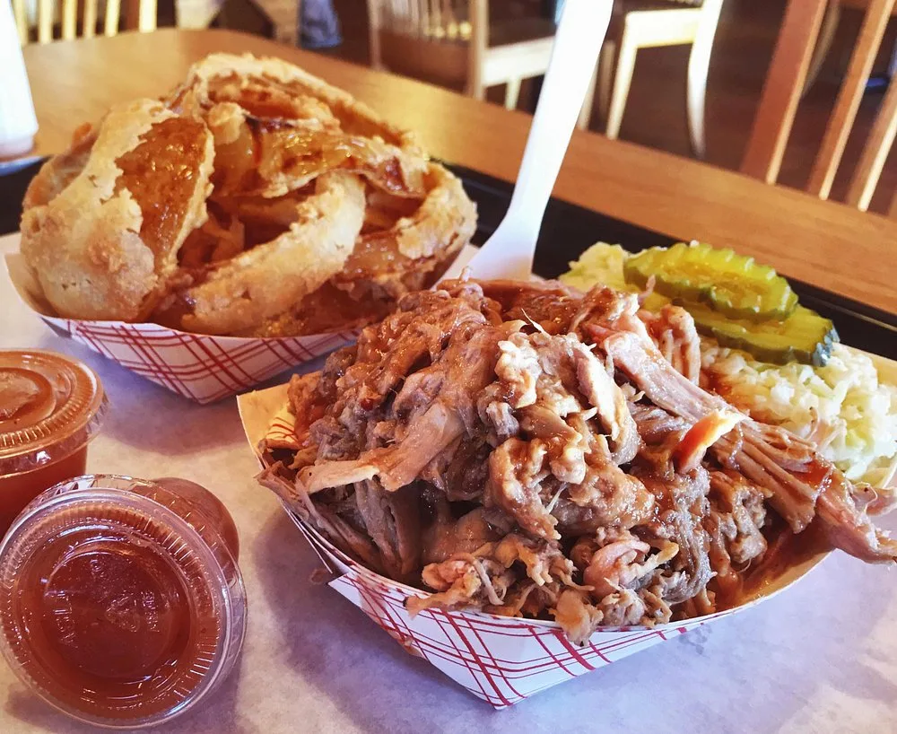 Overhead view of a BBQ tray with onion rings