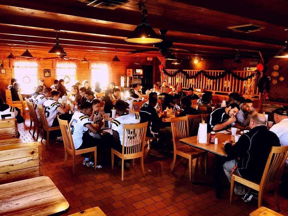 Bar-B-Q King's dining room packed with a local football team eating together after a game