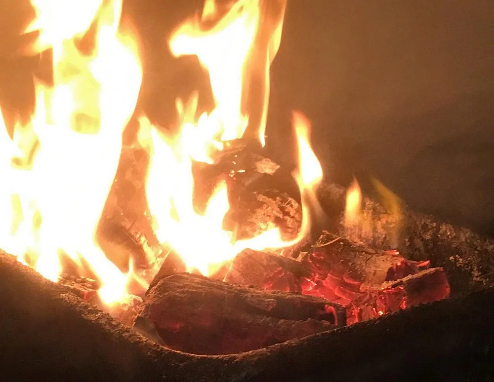 Bed of glowing red hickory coals used to pit smoke BBQ King's barbecue since 1971