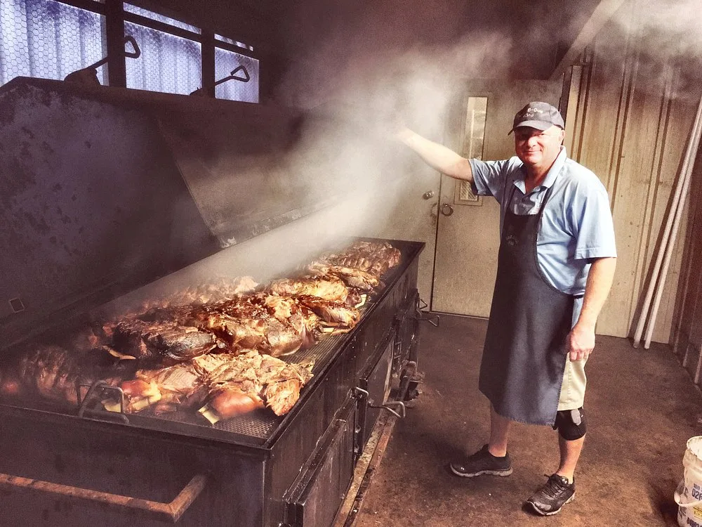 Keith Smith presenting the smoking pit at Bar-B-Q King